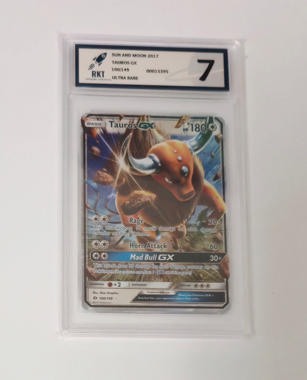 Graded Tauros GX 100/149 Sun and Moon Pokémon Ultra Rare card, RKT 7, sealed in protective slab