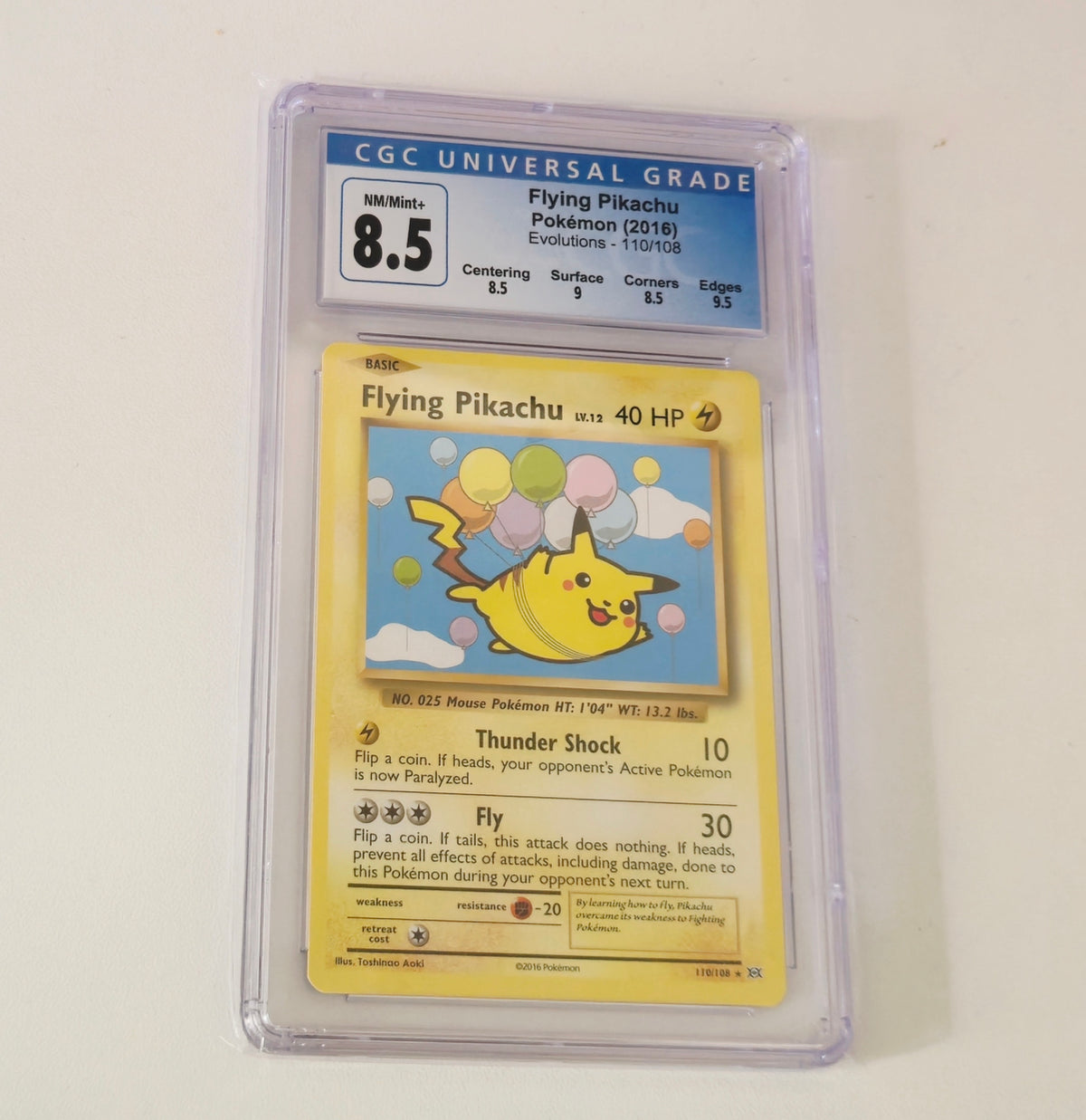 Graded Flying Pikachu 110/108 Evolutions Pokémon card, CGC 8.5, sealed in protective slab