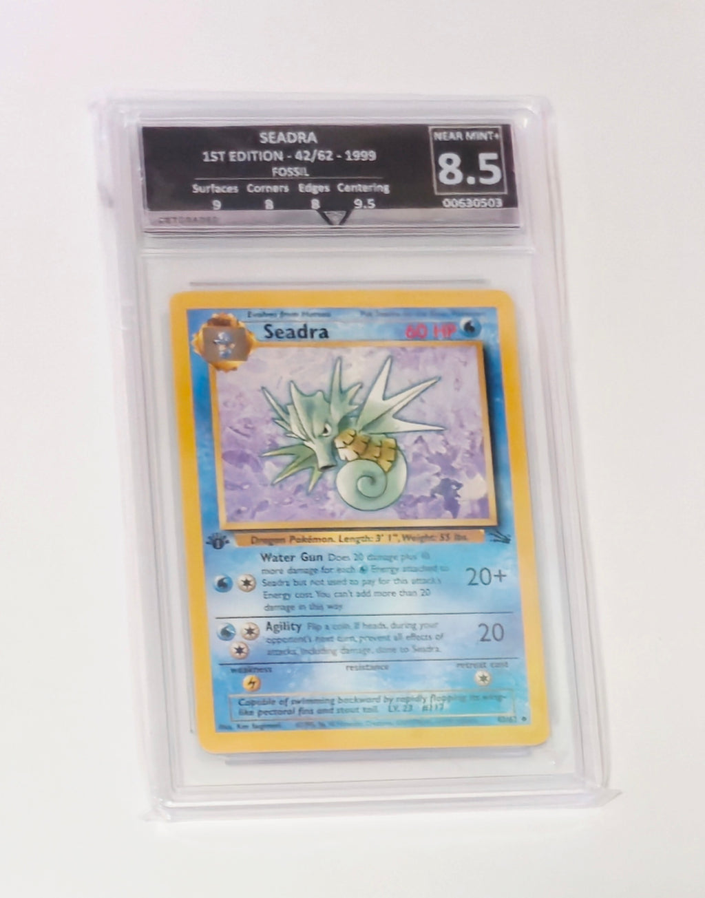Graded 1st Edition Seadra 42/62 Fossil Pokémon card, GG 8.5, sealed in protective slab
